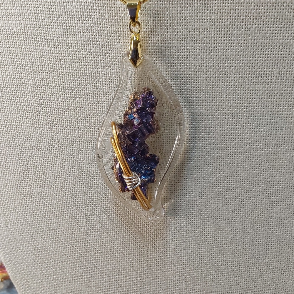 Necklace with brass. Bismuth metal. on resin